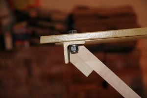 The brace is cut carefully to fit into the angle iron.